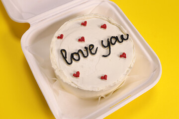 bento cake for a loved, gift for birthday and valentine's day on yellow background