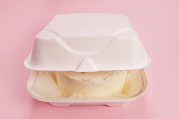 Bento cake in a box on a pink background