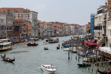 Fototapeta na wymiar Venetian canals with countless boats and gondolas. 