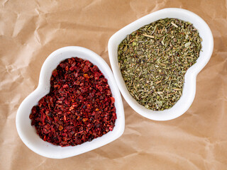 Pair of spices in heart-shaped white bowls