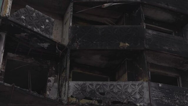 War in Ukraine, a charred house, charred balconies of a multi-storey building, Borodianka after de-occupation