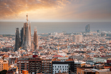 Beautiful aerial view of the Barcelona city with a Sagrada Familia cathedral standing in the city center.