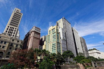 Fototapeta na wymiar View of the buildings in Anhangabaú Valley with a blue sky in the background. Downtown of São Paulo city, Brazil