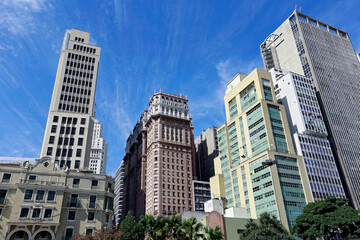 Fototapeta na wymiar View of the buildings in Anhangabaú Valley with a blue sky in the background. Downtown of São Paulo city, Brazil