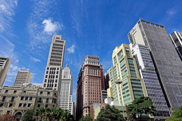 Fototapeta premium View of the buildings in Anhangabaú Valley with a blue sky in the background. Downtown of São Paulo city, Brazil