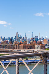 New York skyline and midtown from the Brooklyn Bridge on a summer day