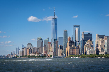 Freedom tower and lower Manhattan panorama from a ferry on the Hudson river on a summer day