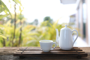 White tea pot and tea cup