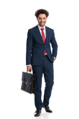 full body picture of turkish businessman with hand in pocket smiling