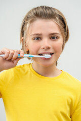 SchoolBoy Brush Teeth Child Looking At Camera Over White Background, Dentistry, Stomatology, Dental Care Hygiene With Toothbrush Toothpaste, Morning Evening Routine, Lifestyle, Health Care. Vertical