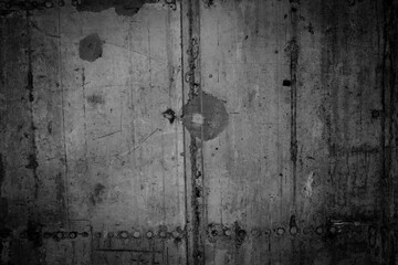Naklejka na ściany i meble Close-up of cracks in black concrete