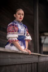Young beautiful slovak woman in traditional dress. Slovak folklore