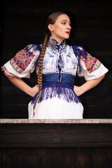 Young beautiful slovak woman in traditional dress. Slovak folklore