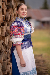 Young beautiful slovak woman in traditional dress. Slovak folklore