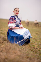 Young beautiful slovak woman in traditional dress. Slovak folklore