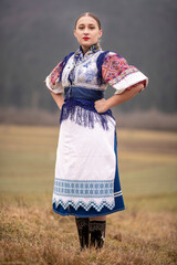 Young beautiful slovak woman in traditional dress. Slovak folklore