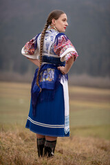 Young beautiful slovak woman in traditional dress. Slovak folklore