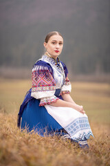 Young beautiful slovak woman in traditional dress. Slovak folklore
