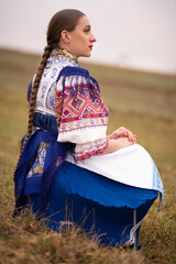 Young beautiful slovak woman in traditional dress. Slovak folklore