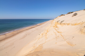 One of the most beautiful beaches in Spain, called (El Asperillo, Doñana, Huelva) in Spain.  Surrounded by dunes, vegetation and cliffs.  A gorgeous beach.