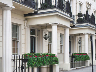 Fototapeta na wymiar Row of cream colored townhouses in upper class area of London