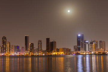 Fototapeta na wymiar Sharjah urban cityscape skyline night scene