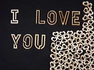 the words I love you and hearts made of wood on Valentine's day