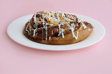 fresh pastries. currant pie is sprinkled with white chocolate. blueberry bun in white chocolate