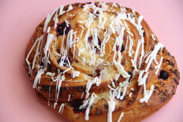 fresh pastries. currant pie is sprinkled with white chocolate. blueberry bun in white chocolate