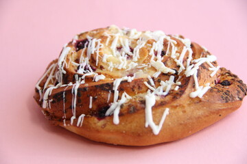 fresh pastries. currant pie is sprinkled with white chocolate. blueberry bun in white chocolate