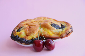 fresh pastries. cake with poppy seeds and cherries. cherry and poppy seed bun.