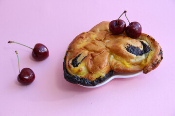 fresh pastries. cake with poppy seeds and cherries. cherry and poppy seed bun.