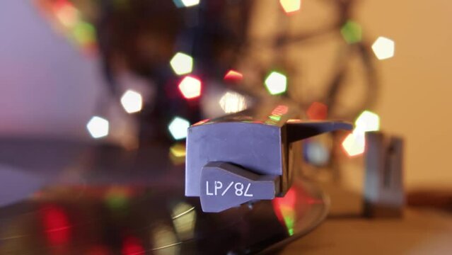 Record player turntable against bokeh lights cinegraph
