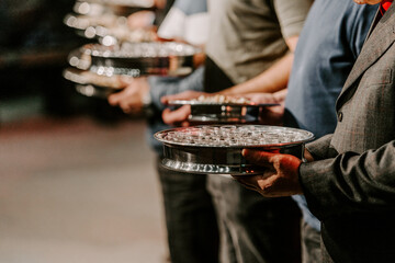 Communion with bread and wine during the service in the assembly