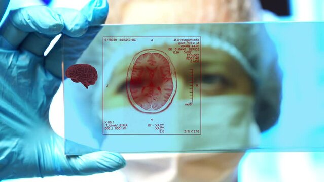 Medical technology concept. Remote medicine. Electronic medical record. doctor examines holographic model of computed tomography and electrocardiogram