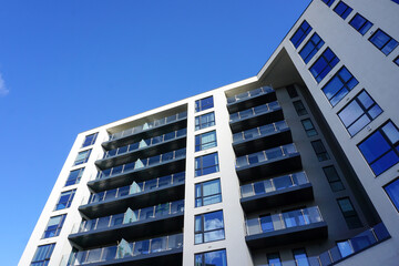 modern apartment building under blue sky. real estate image with copy space 