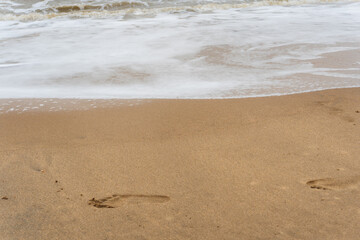 footprints on the sand. beach, wave and footprints 