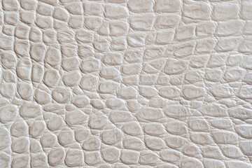 Texture of genuine leather close-up, embossed under light color print