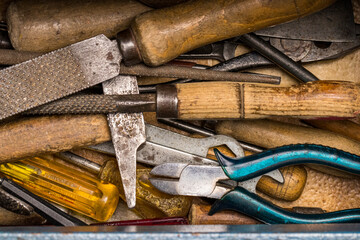 Vintage toolbox open with old grunge tools inside