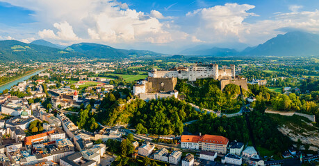 Beautiful aerial drone panorama of Salzburg city in Austria. View of the historic city of Salzburg and Salzach river at summer.