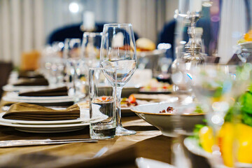 a festive served table with snacks and tableware.