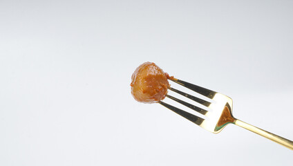 Cilok on a fork isolated over white background. Cilok is a traditional food that comes from West Java Indonesia