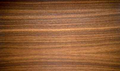 Photo of the mahogany texture of the countertop.Wooden background for decoration. Vintage veneer for finishing premium furniture.