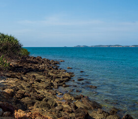 Landscape summer frontview panorama tropical seabeach rock blue sky white sand background calm...