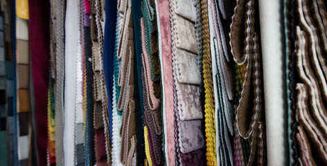 Samples of fabrics of different quality and category for furniture upholstery. Colorful upholstery fabric samples. Assortment of fabric samples.