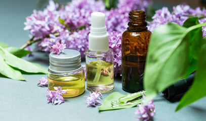 Fototapeta na wymiar Lilac flowers aroma oil, flowers essential oil, pure essence