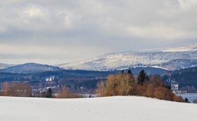 Fototapeta na wymiar Snowy rural mountain winter landscape.