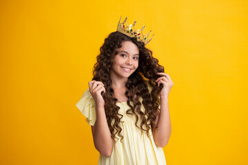 Happy teenager. Girls birthday party, funny kid in crown. Imagine herself a queen, child wear...