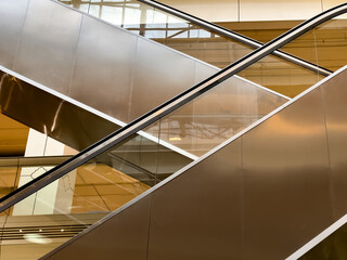 Close-up side view of escalator. Close-up of escalator and handrail