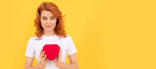 portrait of girl with heart. happy valentines day. be my valentine. lady on yellow background. Woman isolated face portrait, banner with copy space.